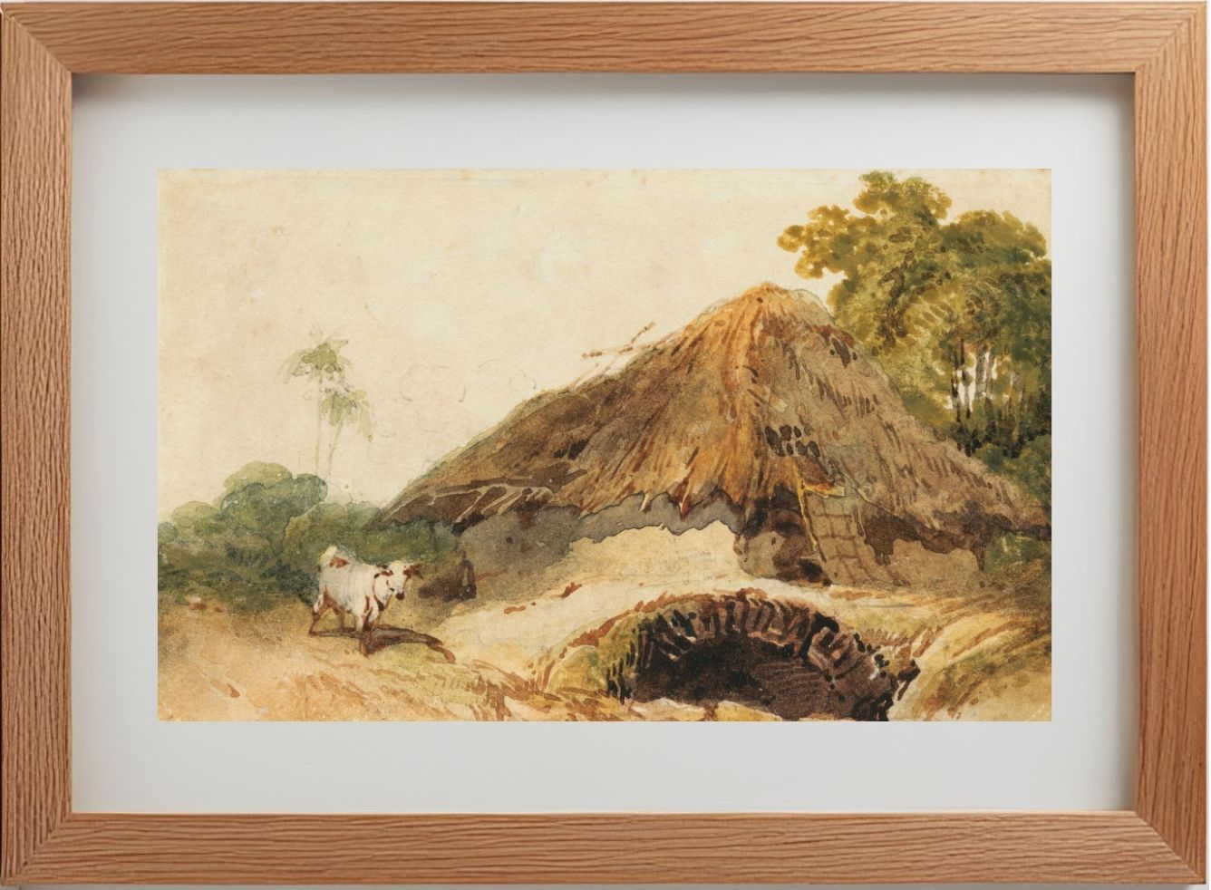 A Bengal scene with a thatched dwelling and a goat beside a bridge