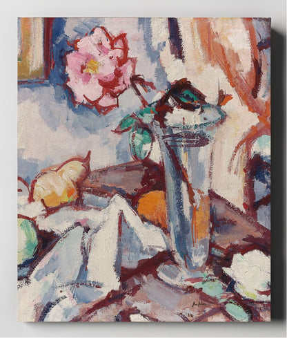 Pink rose in a glass vase with fruit