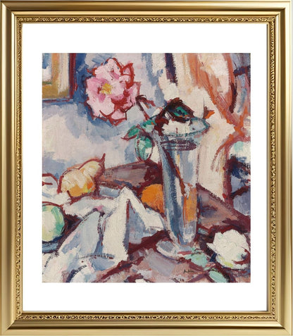 Pink rose in a glass vase with fruit