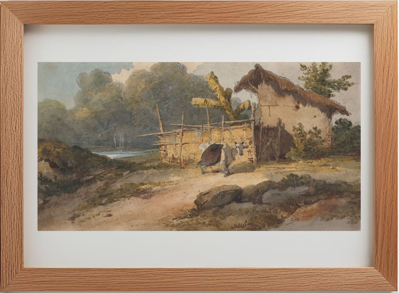 A hut by a river with a cow, Bengal